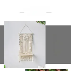 Detailed view of handmade woven cotton tapestry with a natural wood floating shelf
