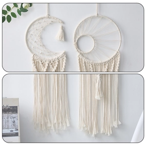 Detail of bohemian handmade woven moon and sun dreamcatchers with fringe tassels