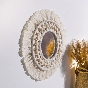 Boho woven wall mirror with macrame fringes and wooden beads in handcrafted design