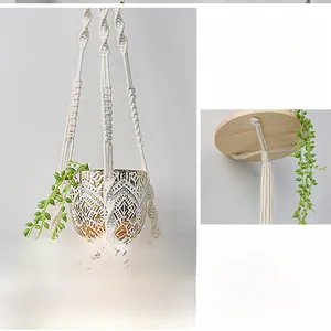 Detailed macro view showing the hand-woven cotton rope knots and round wooden base support