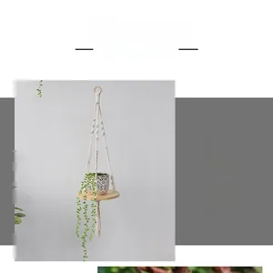 Detail of hand-woven bohemian cotton rope basket with solid wood tray and tassel