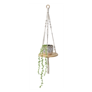 Nordic macrame plant hanger with wooden shelf and ivory cotton rope hanging on white background