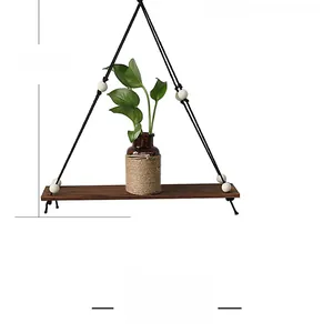 Detail showing a 42cm hanging wooden shelf with black rope and decorative white beads