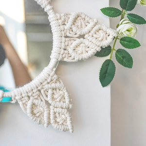 Handmade macrame flower wall mirror in off-white cotton rope for boho home decor