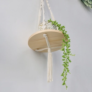 Bohemian handmade woven wall hanging shelf with round wooden tray and cotton tassels