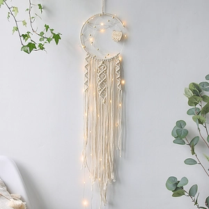 Handmade moon-shaped macrame dream catcher with warm LED lights and a wooden owl charm