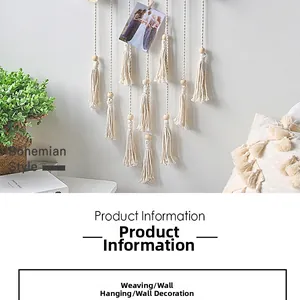 Detail of bohemian handwoven cotton wall hanging with wooden beads and tassels