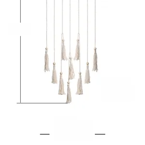 Detail of bohemian macrame wall hanging showing 85x45cm dimensions and tassel beads