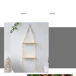 Detailed macro view of double-layer macrame wall shelf with cotton rope and tassels