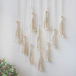 Bohemian woven macrame wall hanging with wooden beads and fringes for home decor