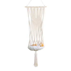 Handwoven macrame cat hammock with heart pattern and fringe for pet resting