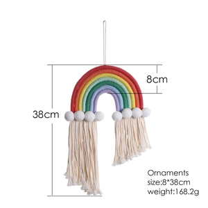 Handmade rainbow woven wall hanging with six colors and tassels for nursery decor
