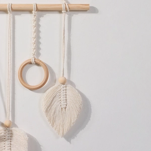 Handmade boho macrame wall hanging shelf with cotton rope tassels and wooden rod