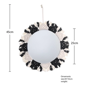 Bohemian woven wall mirror with black and white cotton fringe, dimensions 45cm diameter