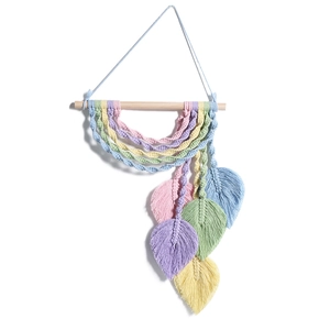 Detail of macrame leaf wall hanging featuring colorful pastel cotton ropes and textures