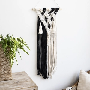 Bohemian hand-woven wall tapestry with geometric patterns and fringe for home decor