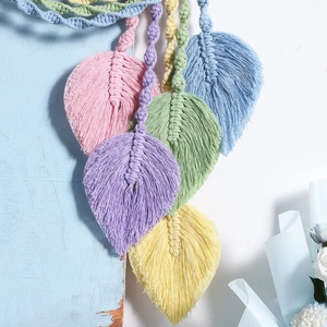 Handmade Macaron-colored woven leaf wall hanging with cotton tassels for Nordic home decor