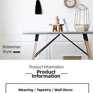 Detail of black bohemian woven wall tapestry with fringe decor in a cozy room