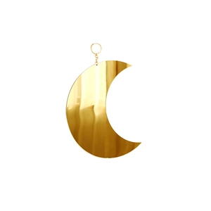 Close-up of golden crescent moon hanging mirror with reflective metallic surface