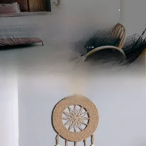 Close-up of handmade woven macrame wall hanging with wooden beads and fringes