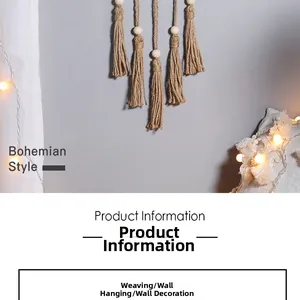 Detail of bohemian handmade woven tapestry with tassels and wooden beads on a wall