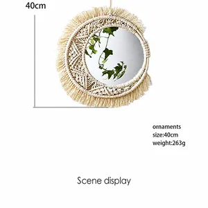 Detail of 40cm boho wall mirror with handmade macrame fringe and clear reflection