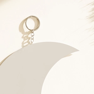 Bohemian crescent moon keychain with matte white finish and silver metallic keyring