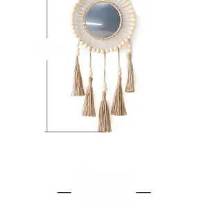 Detail of 55cm boho wall mirror with macrame tassels and decorative wooden beads