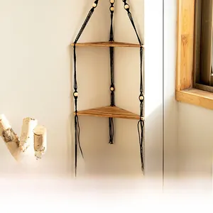 Detail of 2-tier triangle wooden hanging shelf with black ropes and yellow beads