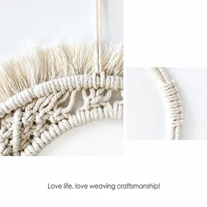 Detail of handmade macrame weaving technique with cotton tassels on bohemian mirror