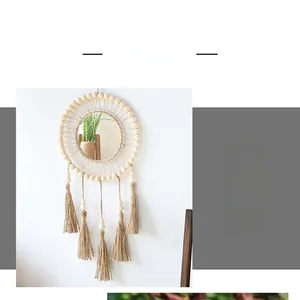 Detail of bohemian woven wall mirror featuring wooden beads and hanging tassels