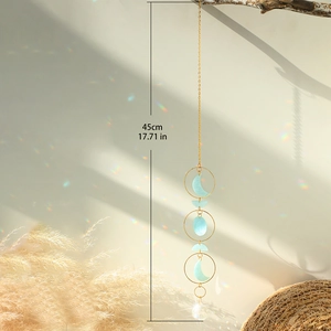 Detail of 45cm crystal suncatcher showing gold metal chain and rainbow light reflection