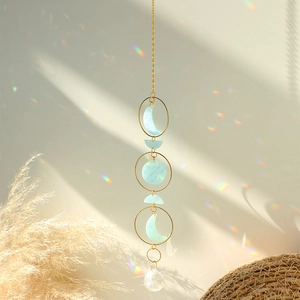 Detailed suncatcher with moon phases, gold metal chain, and faceted crystal ball prism