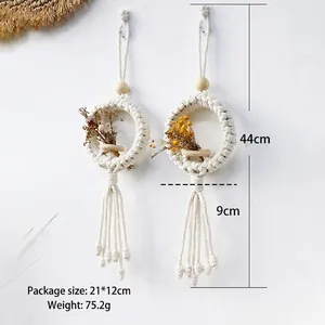 Bohemian handmade macrame wall hanging with dried flowers and long tassels home decor