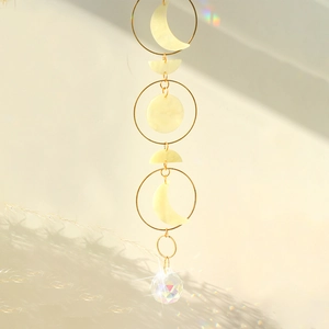 Macro shot of suncatcher with crystal ball showing rainbow light on a clean background