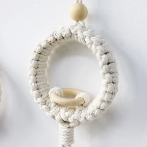 Bohemian handmade macrame wall hanging with natural cotton rope and wooden beads