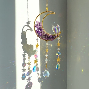 Detailed close-up of golden moon suncatcher with amethyst stones and rainbow crystal prisms
