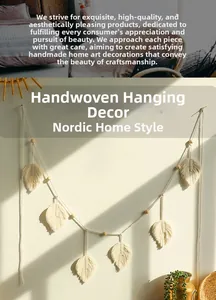Close-up of handmade cream macrame maple leaf wall hanging with natural wooden beads
