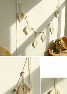 Detail of bohemian handmade cotton leaf wall hanging with natural wooden beads