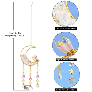 Detail showing crystal rainbow prisms and golden moon frame of the suncatcher