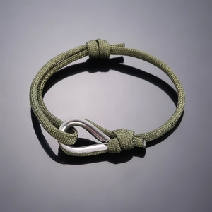 Minimalist army green paracord bracelet with a polished silver stainless steel shackle