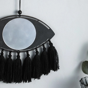 Miroir mural bohème en forme d'œil avec glands noirs et cadre mat pour décoration