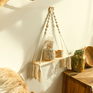 Handmade boho macrame wall hanging shelf with wooden beads and tassels for home decor