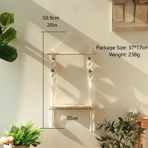 Bohemian handmade macrame wall shelf with evil eye beads and natural wood accents
