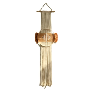 Bohemian handmade macrame wall hanging with wooden stick and woven circular detail
