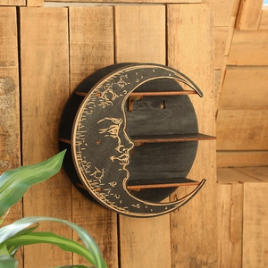 Detailed view of crescent moon wall shelf with three layers and etched celestial patterns
