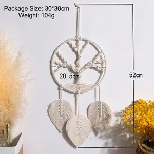 Close-up of bohemian tree of life wall hanging with leaf tassels measuring 20.5x52cm