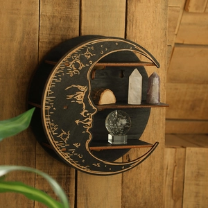 Bohemian moon shaped wooden wall shelf for crystals on natural textured wood background