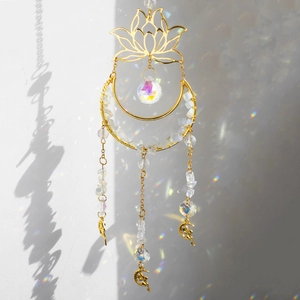 Detailed close-up of suncatcher featuring blue lotus metalwork and natural crystal stones