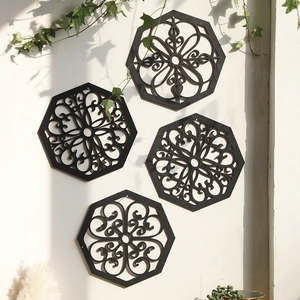 Set of four black hexagonal wall panels with intricate geometric laser-cut patterns